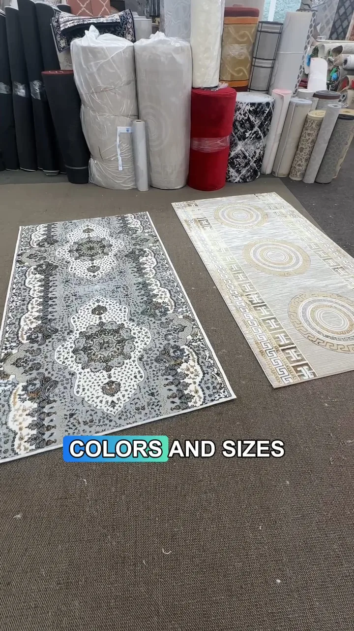 Patterned area rugs laid out beside rolled rugs in the AZ Carpet showroom